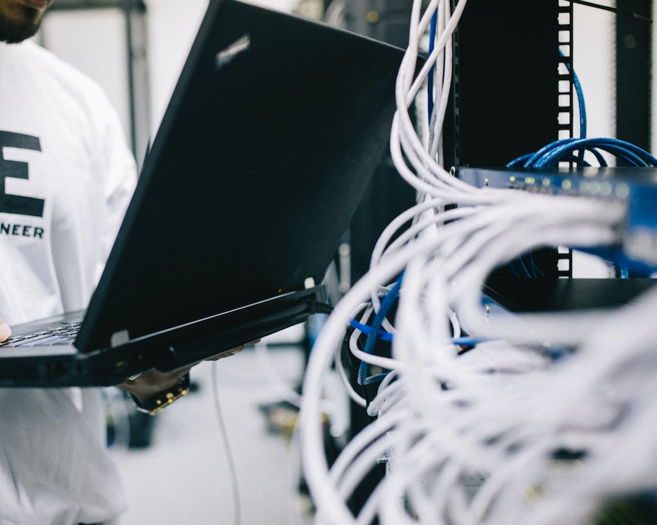 Technician working on a network onsite.
